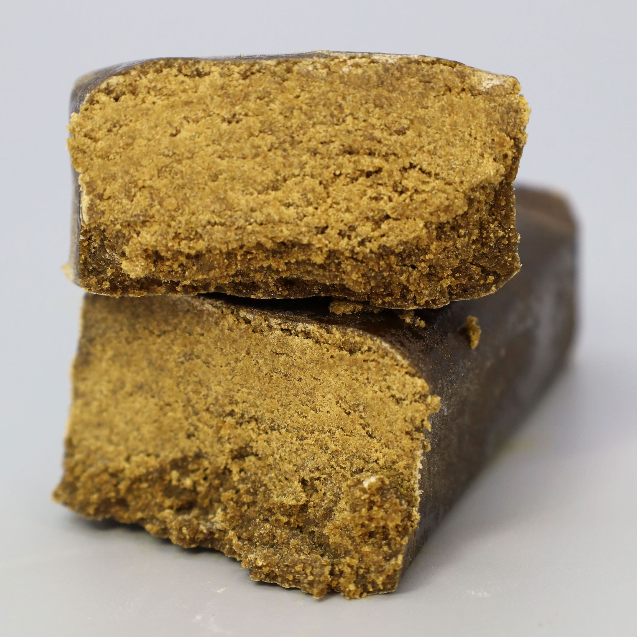 Image on gray background of CBD Hash Manhattan420 by Greenery420